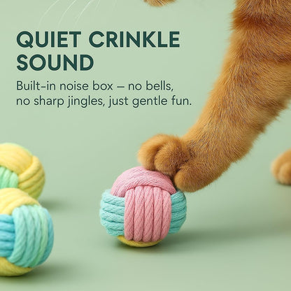 Cat playing with multicolor rope chew ball