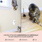 An indoor cat pouncing on the realistic flying bird attachment from Whiskertons.