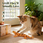 Kitten holding large lizard plush catnip toy