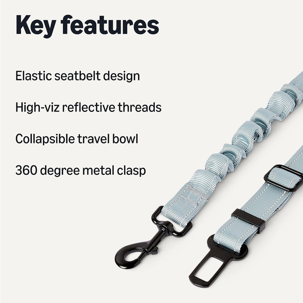 Dog seat belt featuring shock-absorbing elastic and metal clip