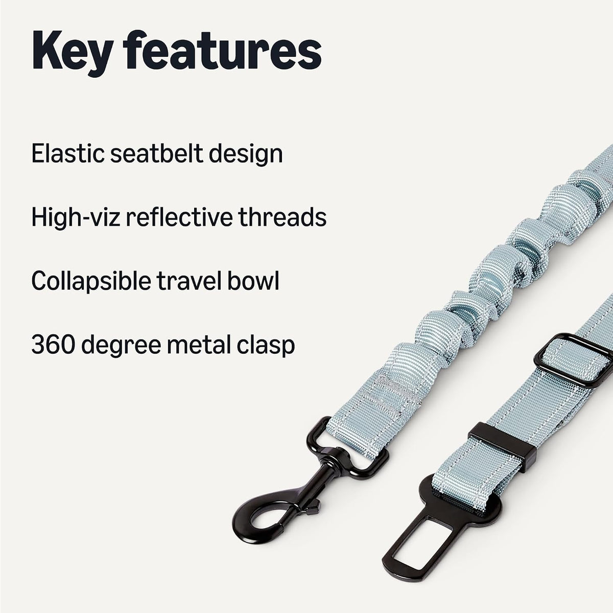 Dog seat belt featuring shock-absorbing elastic and metal clip