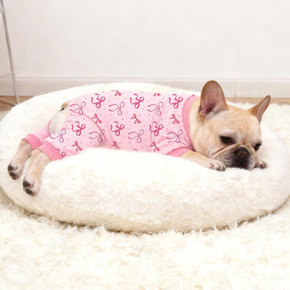 Soft polyester spandex dog jammies with cute magenta polka dots.