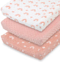 The Peanutshell baby changing pad cover front view in pink minky boho rainbow design