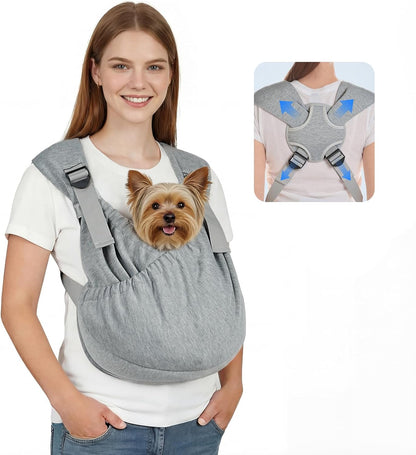 Owner wearing black dog sling carrier for small pets