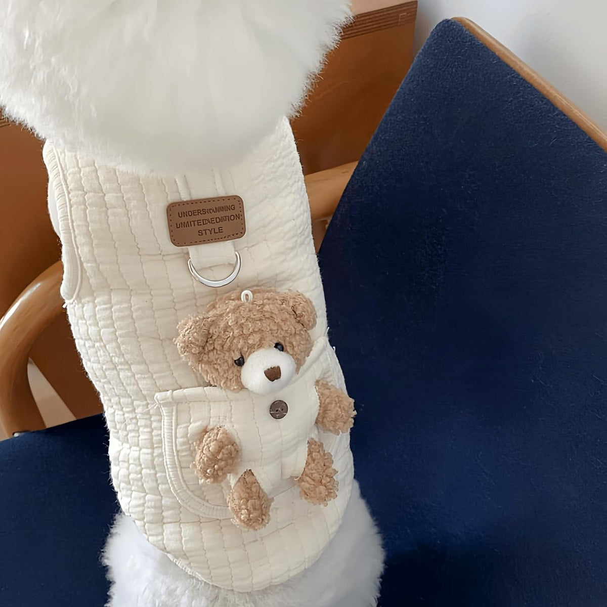 Close up of plush bear pocket on pet apparel