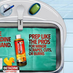 Betadine liquid antiseptic spray bottle on a clean medical background.
