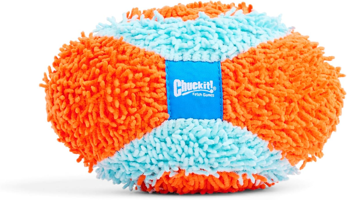 Puppy chasing orange and blue indoor fetch toy