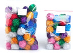 Two inch soft bouncy sparkle ball for cats held in hand to show size scale