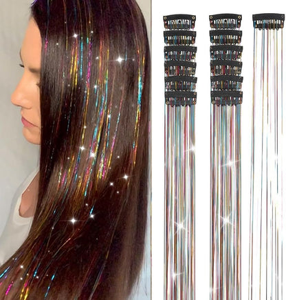 El Regalo hair tinsel kit front view showcasing twelve pieces of rainbow glitter extensions attached to black snap clips.