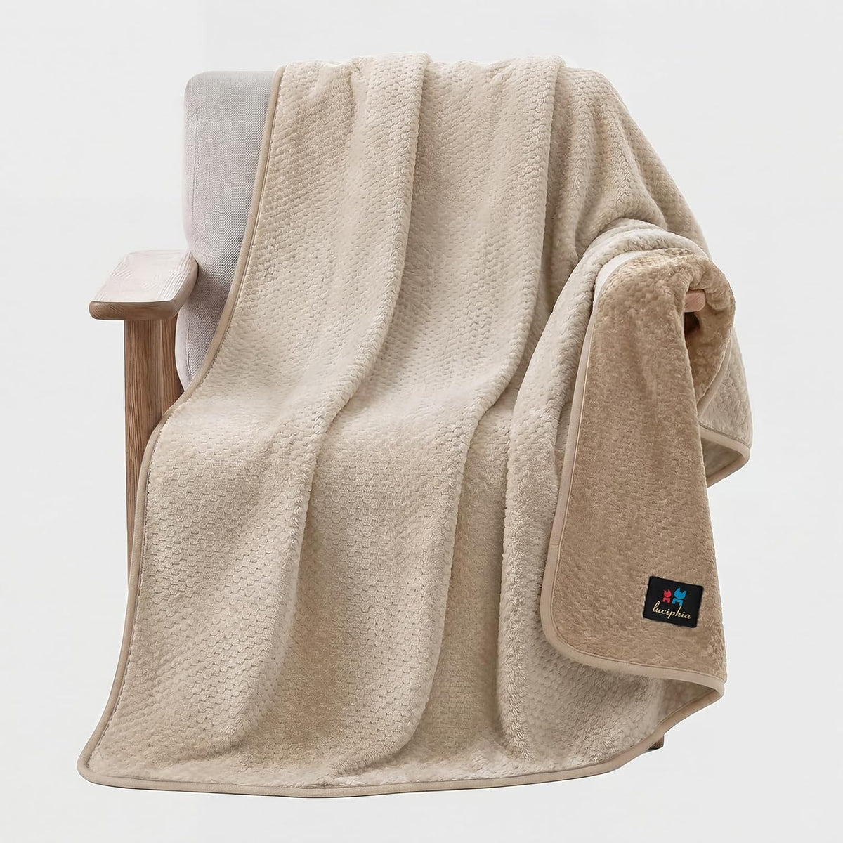 Luciphia waterproof dog blanket front view on a modern living room couch.