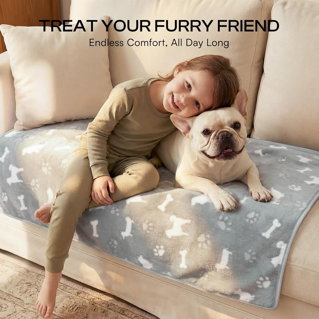 Luciphia premium fleece pet blankets spread out on a living room couch for scratch protection