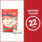 Small dog enjoying Pet Factory knotted beefhide chew treat
