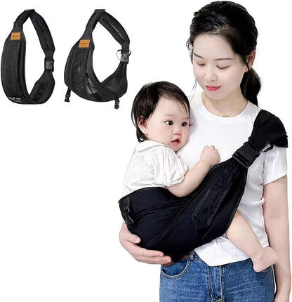 Hewmaw baby sling carrier in black mesh front view being worn by a parent holding a toddler.