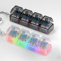 Zioyihan keyboard fidget toy front view showing transparent black and white 4-key blocks