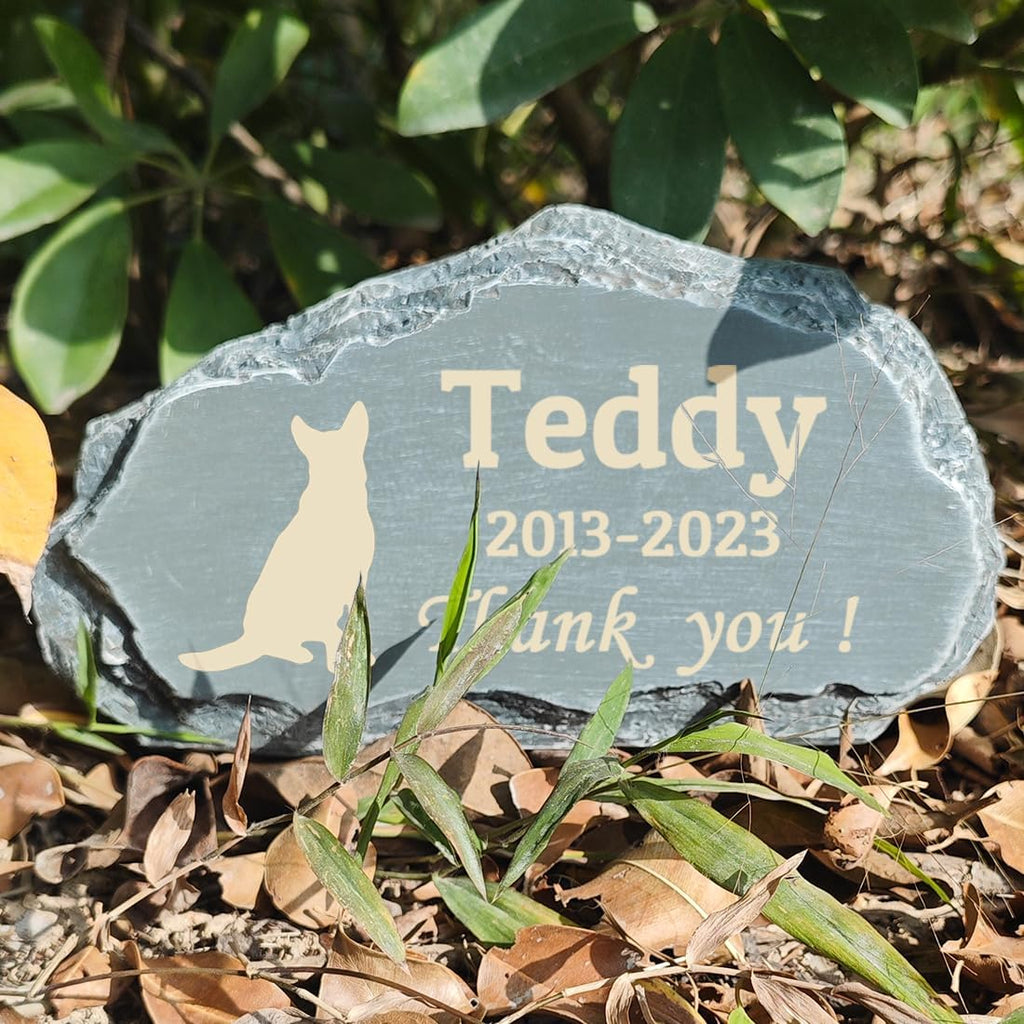 Personalized cat passing away memorial plaque nestled safely under a garden tree