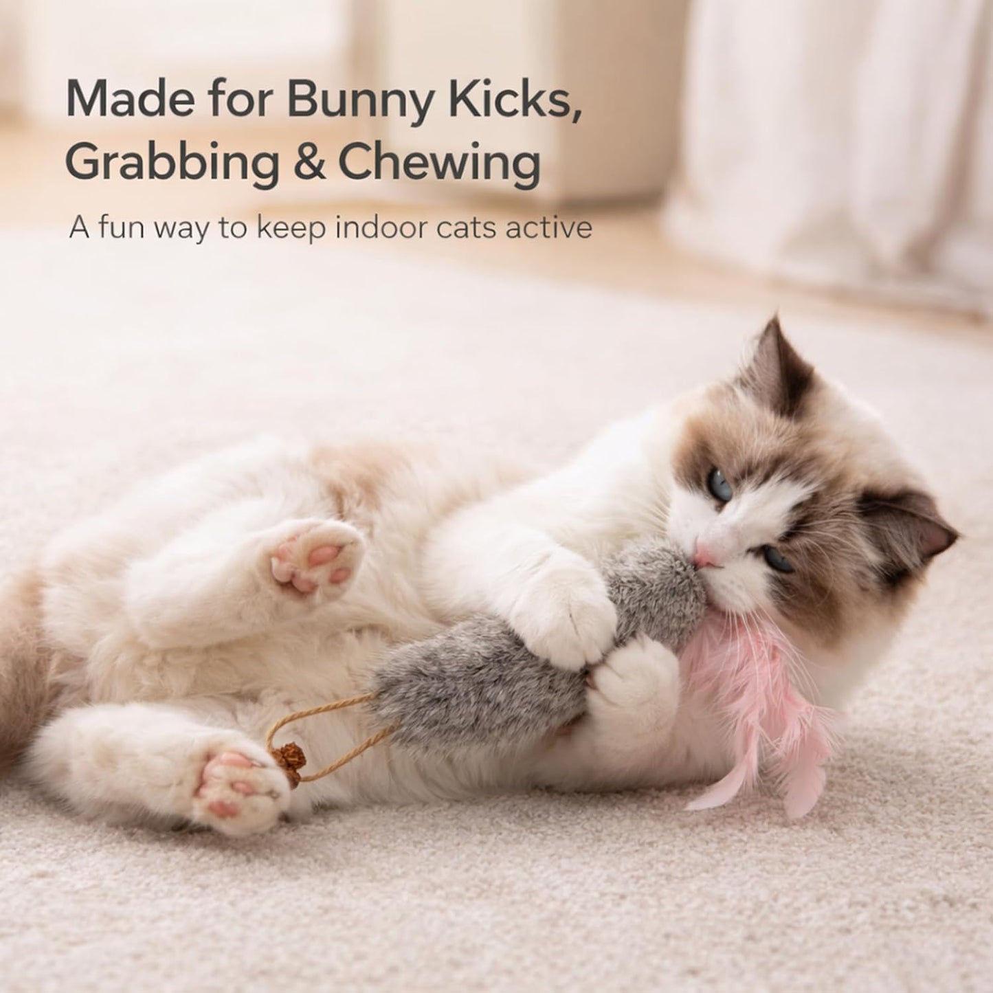 Close up of rabbit fur and feather detail on cat toy