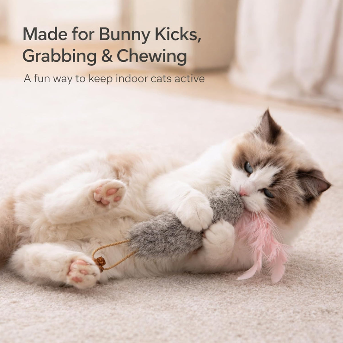 Close up of rabbit fur and feather detail on cat toy