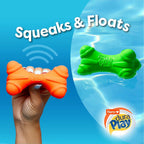 Squeezing the bacon scented dog toy to demonstrate the internal squeaker mechanism.