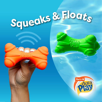 Squeezing the bacon scented dog toy to demonstrate the internal squeaker mechanism.