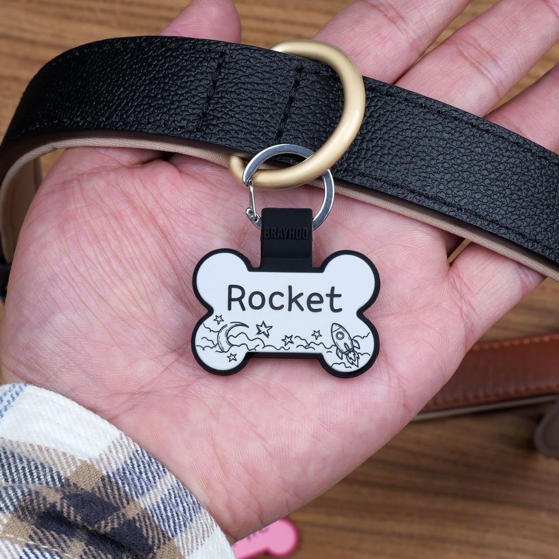 No jingle silicone bone pet ID tag showing secure durable clasp connection.