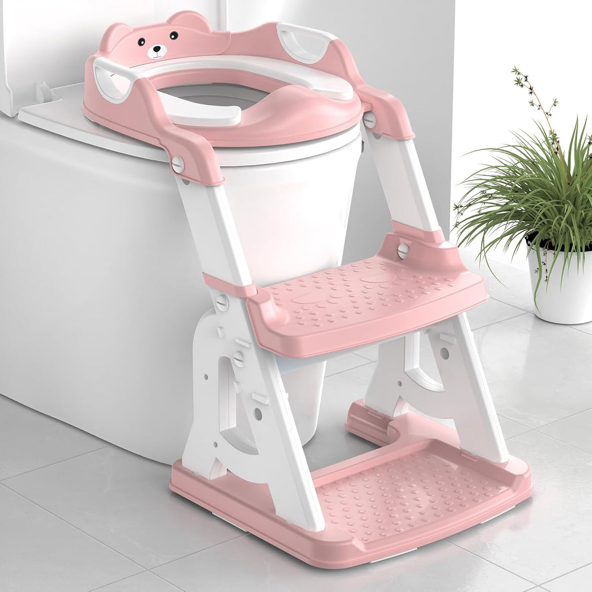 MeuLife potty training seat pink front view on a standard western toilet bowl