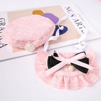 Flat lay of 2 piece pet costume including beret and bowtie bandana