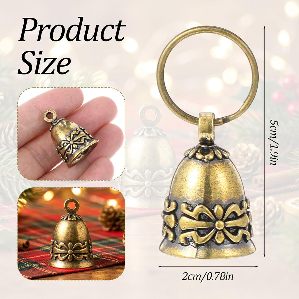Two pieces of copper pet bells displayed with attached metal keyrings for secure pet collar fastening