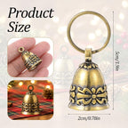 Two pieces of copper pet bells displayed with attached metal keyrings for secure pet collar fastening