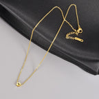 Dainty animal paw print choker chain displayed closely to highlight the high gloss polished finish