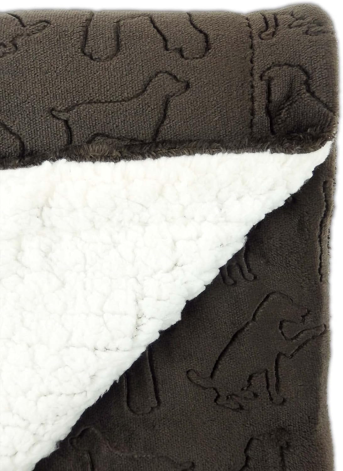 Machine washable premium pet blanket being unfolded for use on a master bed