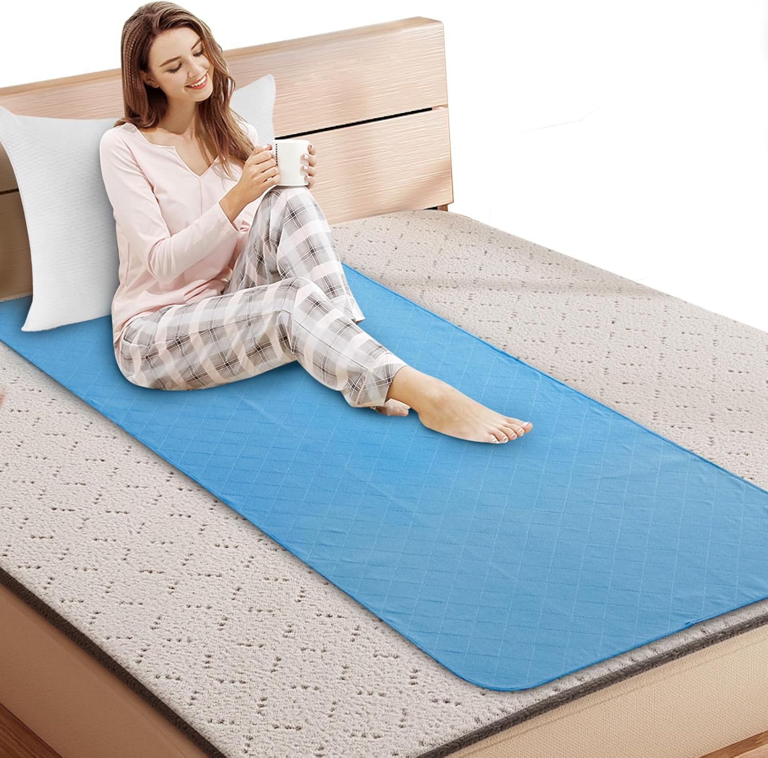 Springspirit hospital bed pads front view on a mattress showing the blue quilted surface.