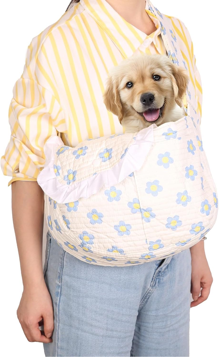 Small dog enjoying travel in floral pet sling