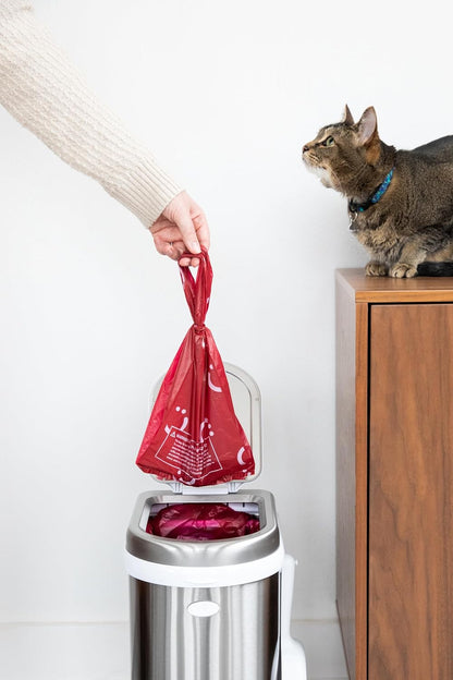 Premium red plastic pet waste bags showing suffocation hazard warning text.