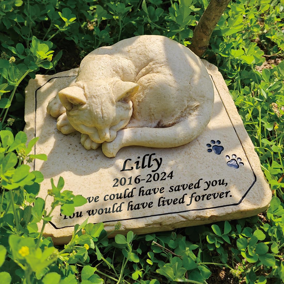 Weatherproof pet memorial monument placed in a backyard lawn setting.