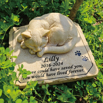 Weatherproof pet memorial monument placed in a backyard lawn setting.