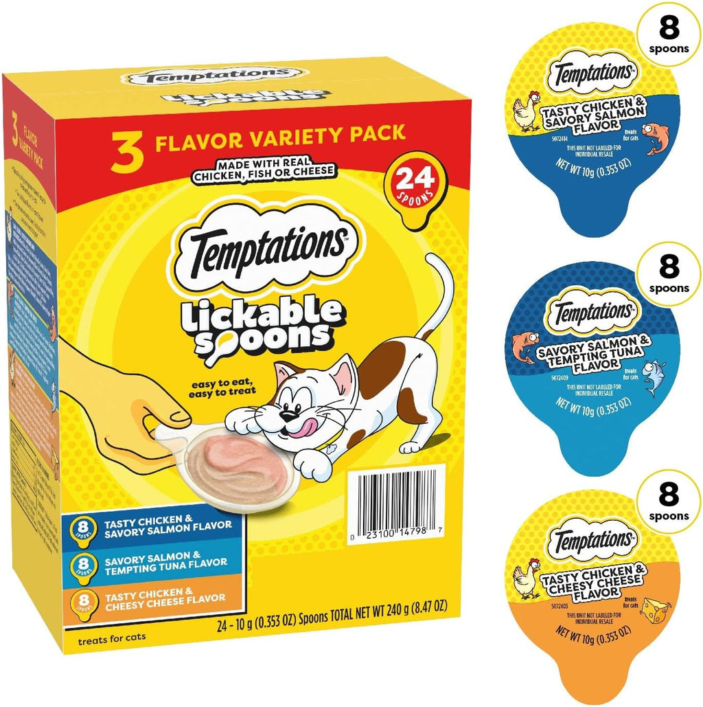 Adult cat licking a Temptations creamy purÃ©e treat directly from the plastic spoon