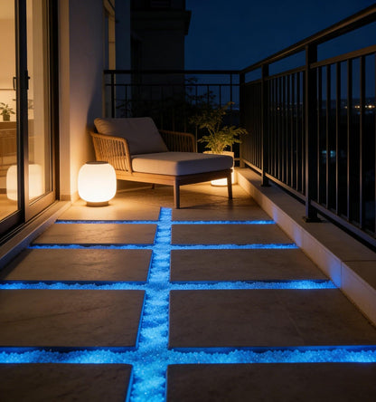 Night time view of blue glow in the dark stones in a vase