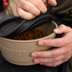 Multiple tan GUNNER dog bowls neatly stacked together for travel storage