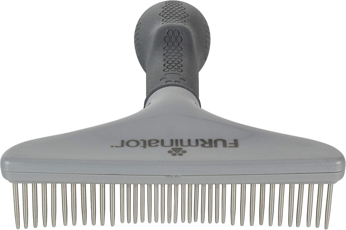 Close up of rotating metal teeth on FURminator rake