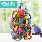 LovyoCoCo bird shredder toy hanging from a metal cage hook.