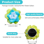 Six assorted color flower charms for dog and cat collars spread out on a clean background