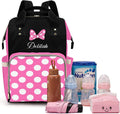 Qubist custom diaper bag front view showing pink Minnie Mouse bow and polka dot pocket