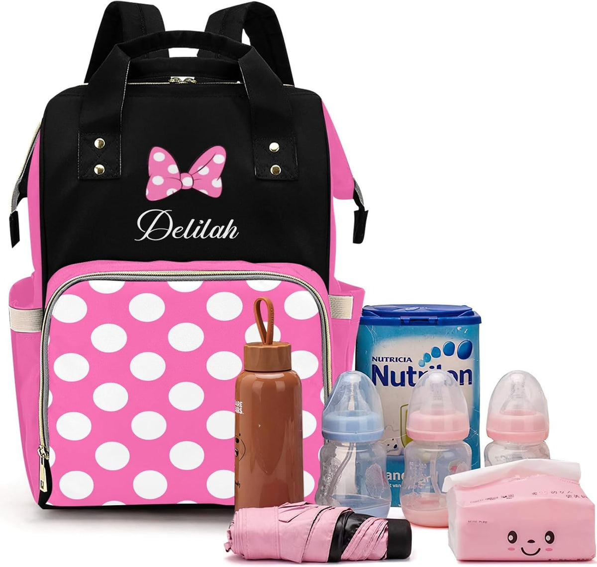 Qubist custom diaper bag front view showing pink Minnie Mouse bow and polka dot pocket