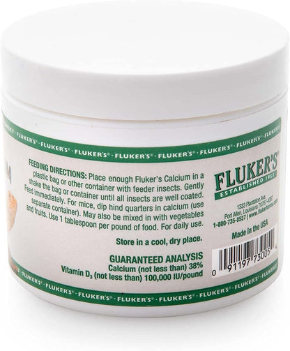 Fluker's reptile supplement container held in hand for scale