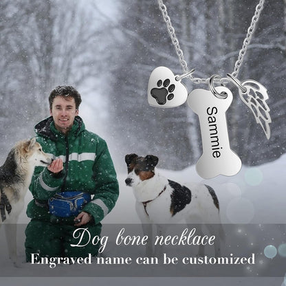 Close up of personalized dog bone charm showing detailed paw print accent.