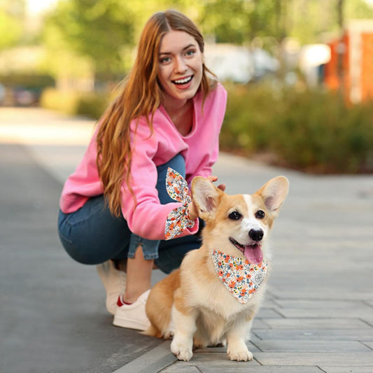 Matching orange and blue flower dog bandana with owner hair scrunchie