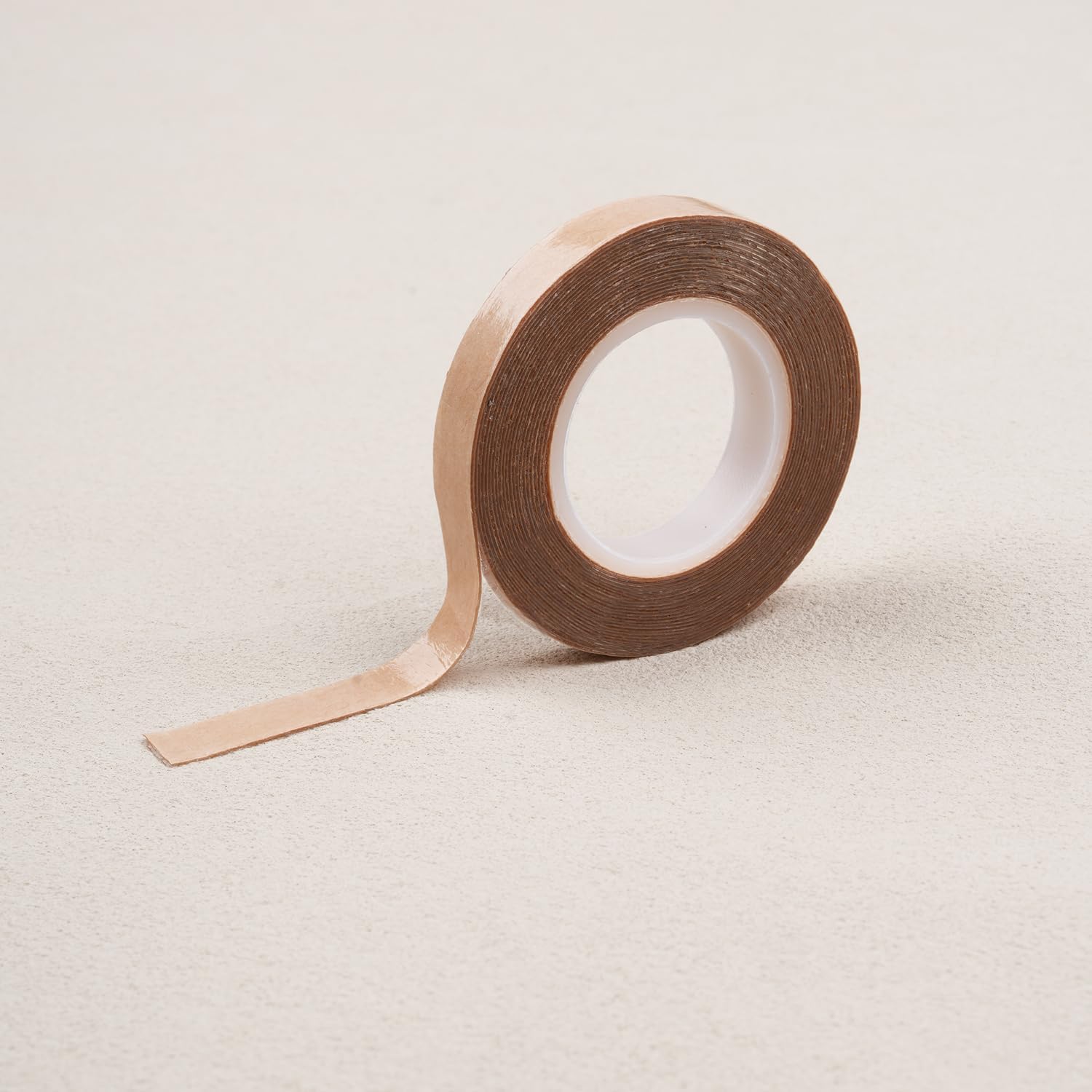WENNALIFE Hair Extension Tape Roll front view showing transparent double sided adhesive roll packaging