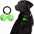 Whimsii dog collar bell front view showcasing green glow copper finish and attachment clasp
