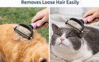 Grooming tool removing loose hair from a cat