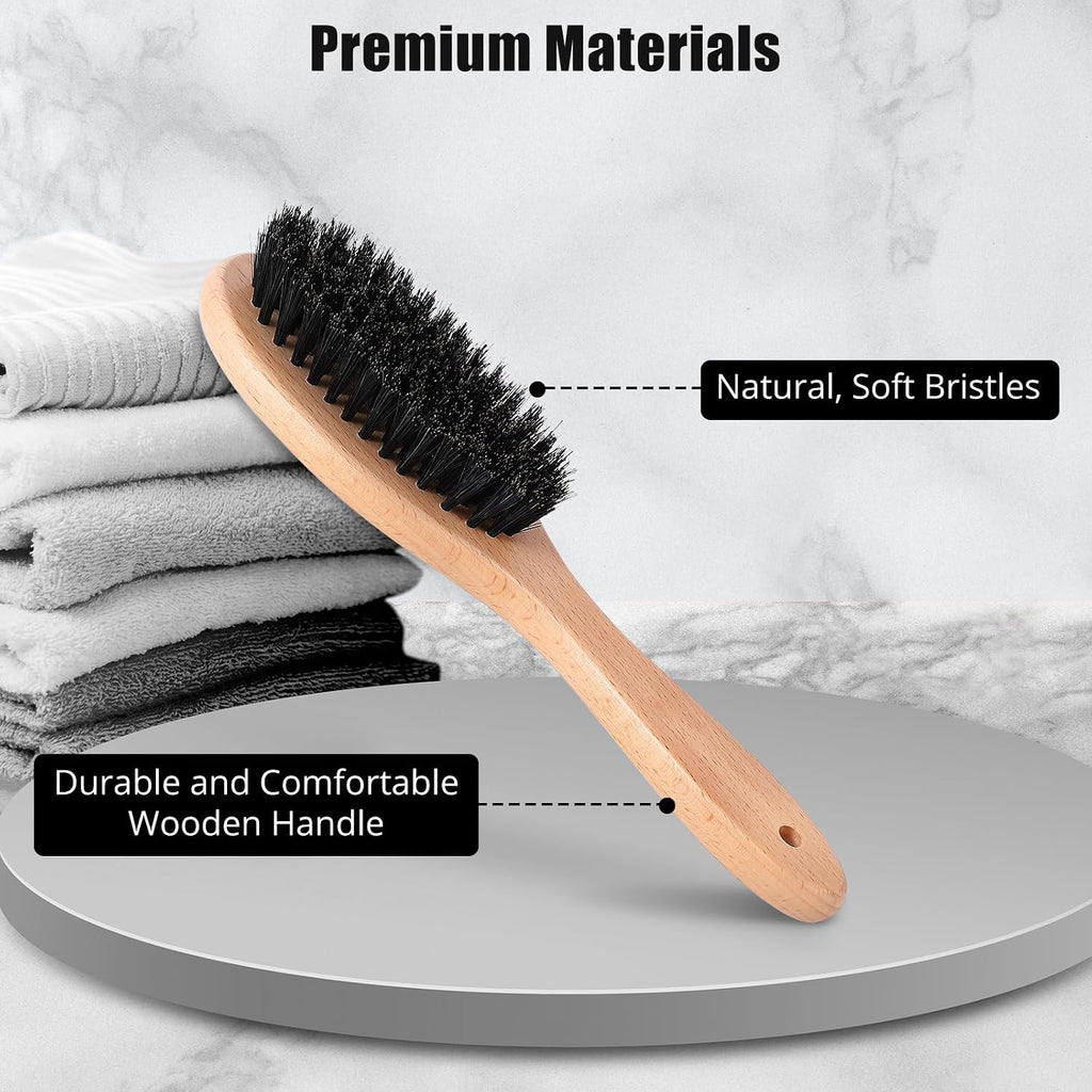 Myselect daily grooming brush alongside loose fur removed from a cat coat.